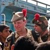 Colonel dons a tam-o’-shanter and leads his troops on a friendly foray into town