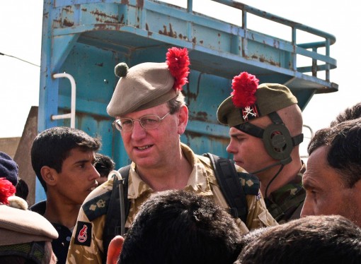 Colonel dons a tam-o’-shanter and leads his troops on a friendly foray into town
